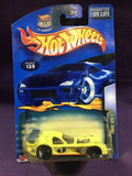 Hot Wheels diecast car in blister pack, yellow race car with black wheels