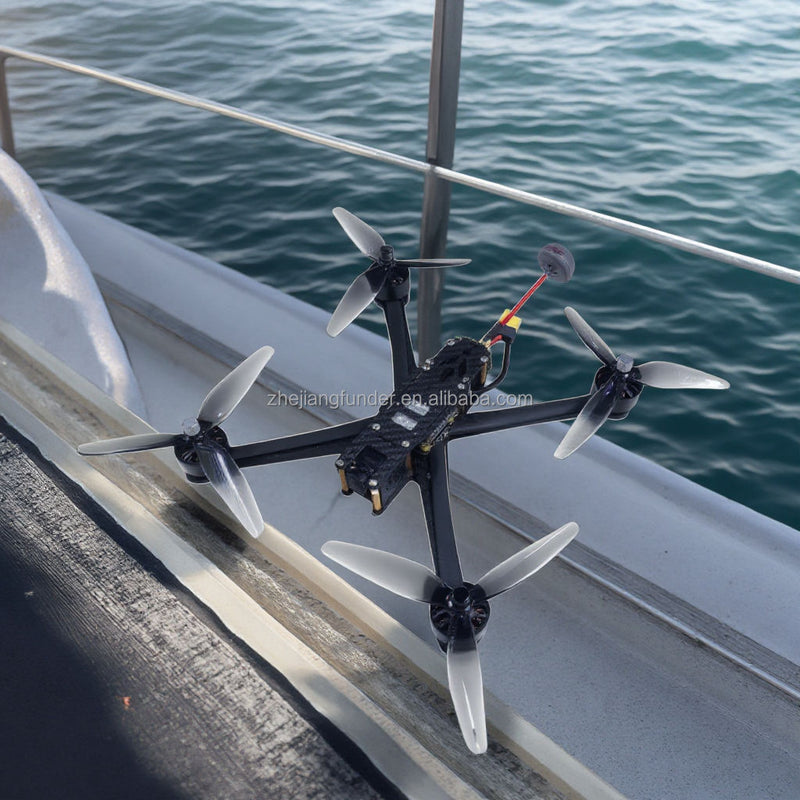 Quadcopter UAV drone with four propellers and central frame, remote-control ready