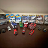 Hot Wheels diecast toy cars in retail packaging, assorted styles and colors