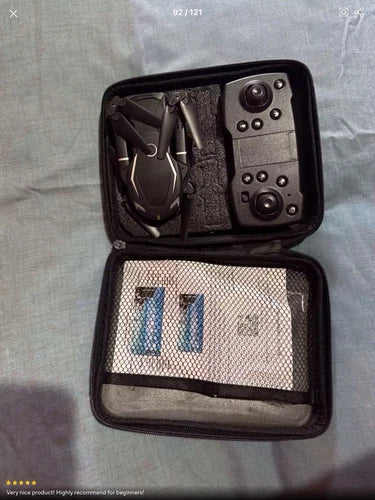 Dual-camera drone in open hard storage case with camera module