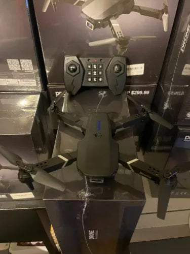 Foldable drone body with front camera module and propellers, gray and dark green