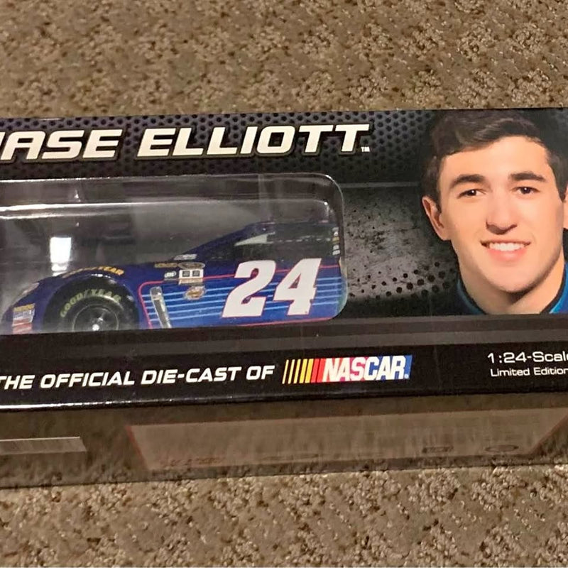 Diecast toy race car in retail box, driver photo, and car number 24