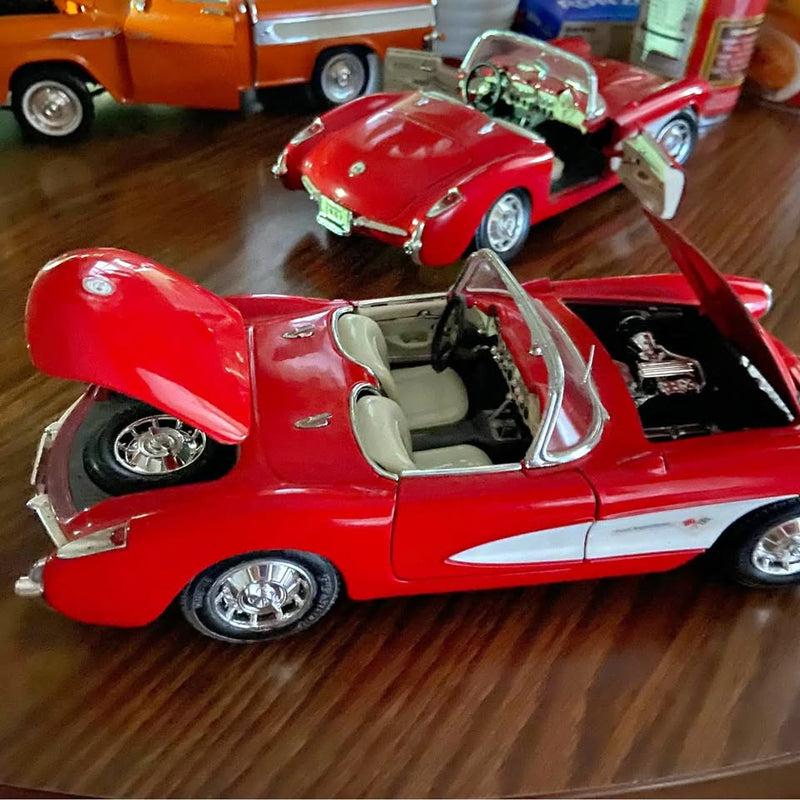 Red 1/18 scale diecast convertible model car, open cabin, chrome wheels and details