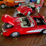 Red 1/18 scale diecast convertible model car, open cabin, chrome wheels and details