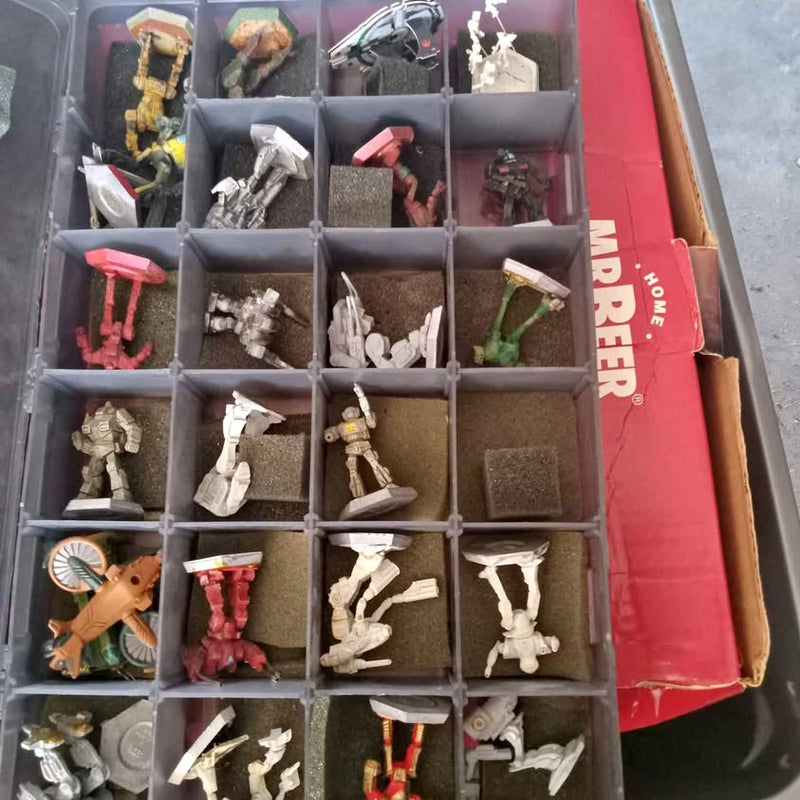 Diecast tabletop game miniatures in gray compartment tray, assorted poses