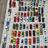 Hot Wheels diecast car assortment with multiple miniature cars