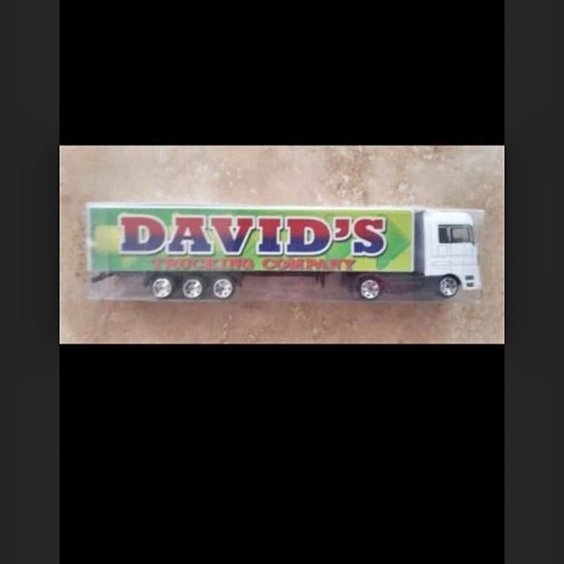 Diecast semi truck with flatbed trailer, white cab and colorful "DAVID'S" print