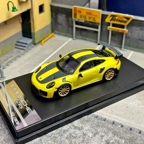 Alloy sports car model diecast with yellow and black body on display base