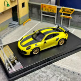 Alloy sports car model diecast with yellow and black body on display base