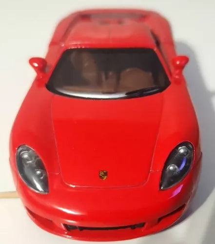 Red Porsche Carrera GT 1:36 diecast toy car, front hood and headlights visible