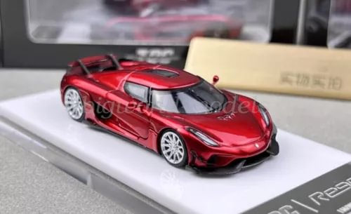 Red diecast sports car model with black roof and silver wheels, detailed front view