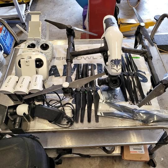 DJI Aspire 1 drone with four propellers and camera gimbal, ready for flight