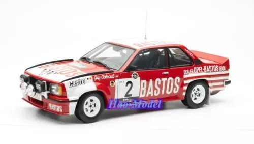 Red and black diecast rally model car with number 2 on door