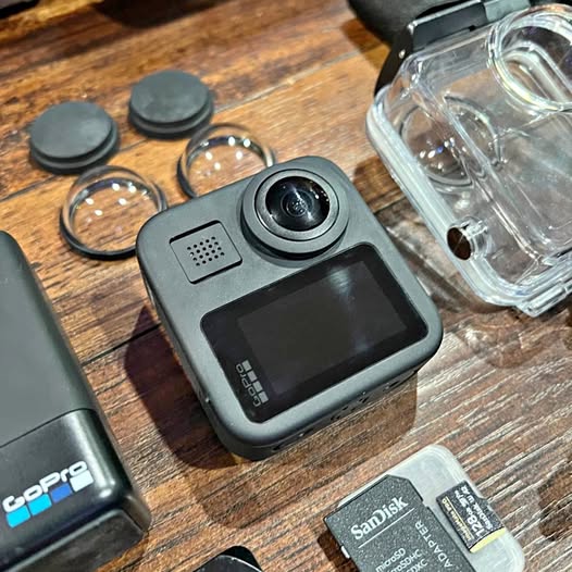 360 action camera with front lens and touchscreen, gray body