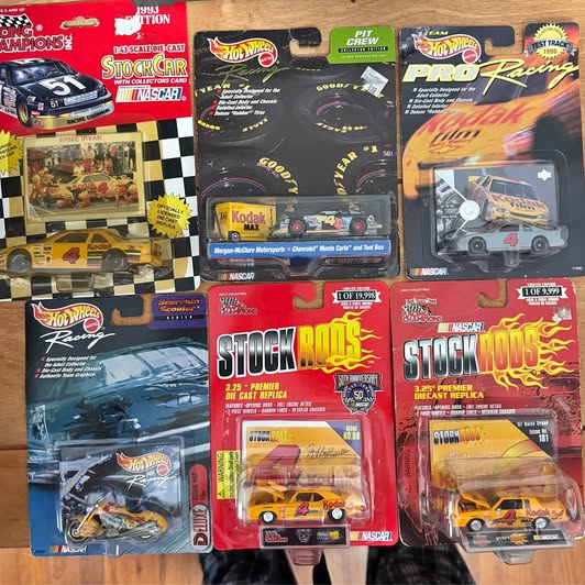 Assorted diecast racing cars in blister packaging with colorful NASCAR Hot Wheels labels