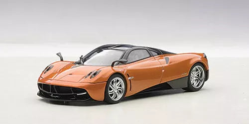 Pagani Huayra 1:43 diecast sports car model, orange with black accents