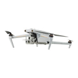 Gray quadcopter drone with front dual camera and four propellers