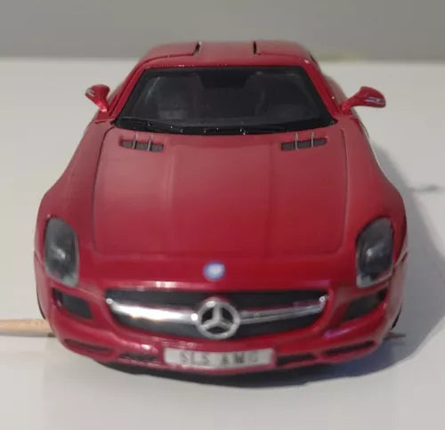 Maroon diecast metal sports car model with Mercedes grille and front headlights