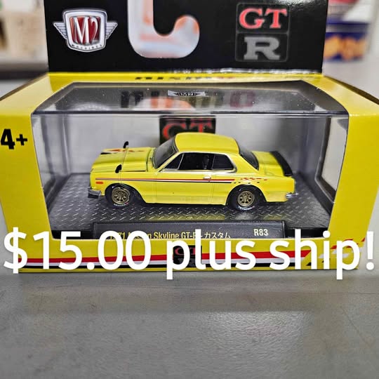 Diecast GT-R model car in yellow with black wheels