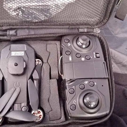 Drone remote controller with joysticks in padded zippered carrying case
