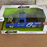 Diecast blue Chevrolet pickup truck model in retail display box
