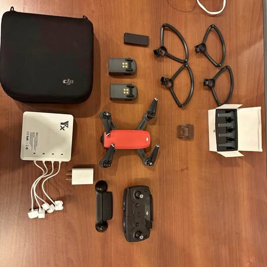 DJI Spark drone kit with remote, spare batteries, propellers, controller and case