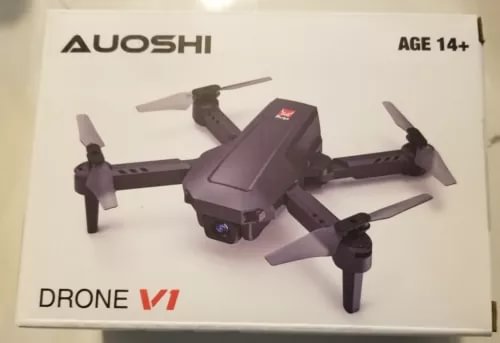Purple camera drone with four propellers and front lens on compact body