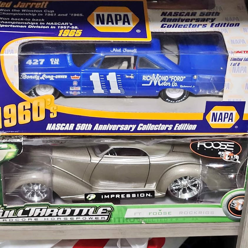 Diecast NASCAR collector car in packaging, blue NAPA #11 design with 1960s graphics