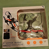 Video drone in retail box with black and orange body and four propellers