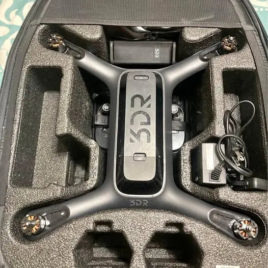 3DR drone in hard case, central body panel and four propellers visible