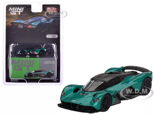 Green and black diecast race car model with aerodynamic body, front three-quarter view