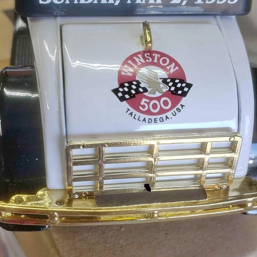 Diecast racing bank with Winston 500 Talladega USA logo and gold front bars