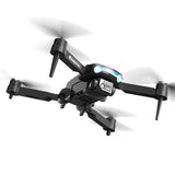 Black quadcopter drone with four propellers and front camera sensor, LED light