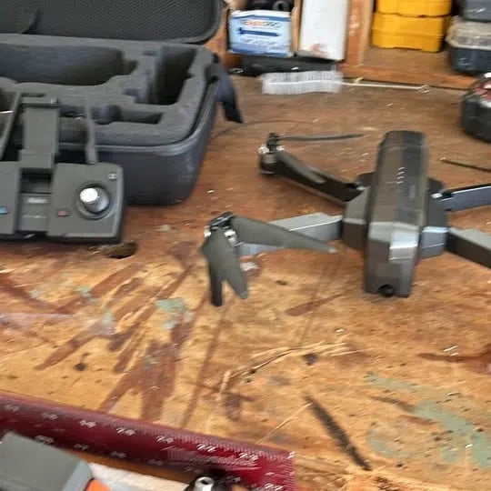 Ruko F11 drone with gray body and folded prop arms