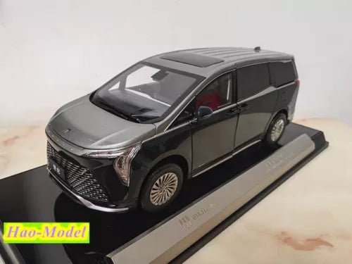 1:18 diecast MPV model car, dark gray front 3/4 view on display base