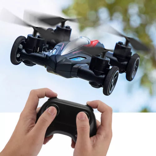 RC quadcopter drone with black handheld controller; four motors visible