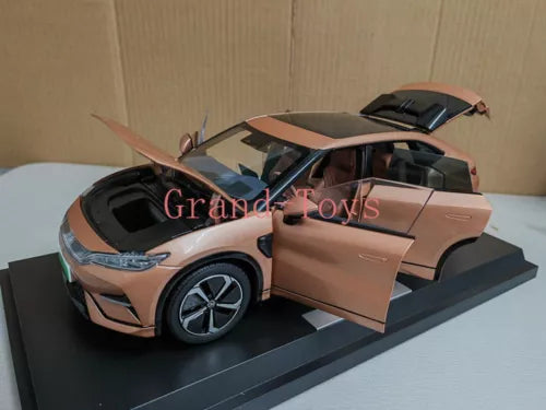 Orange 1:18 scale diecast car model with front door open on display base