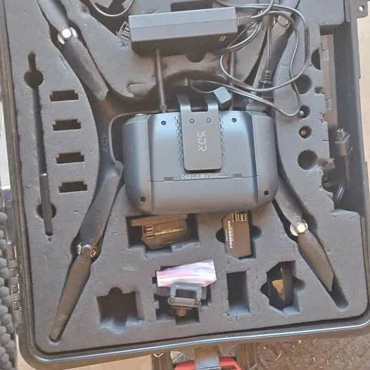 Gray 3DR drone frame with electronics and visible cables