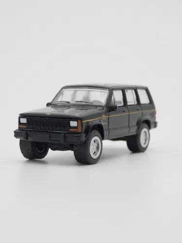 Greenlight diecast SUV toy car, black grille and dark green body, 1:64 scale