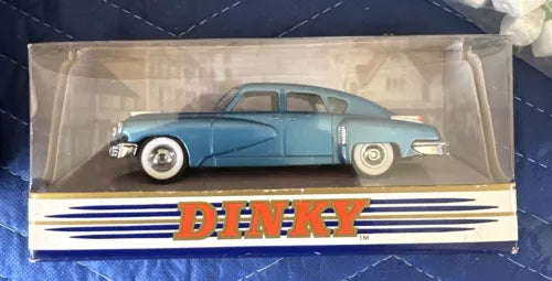 Blue 1948 Tucker Torpedo diecast car in clear display box with DINKY logo