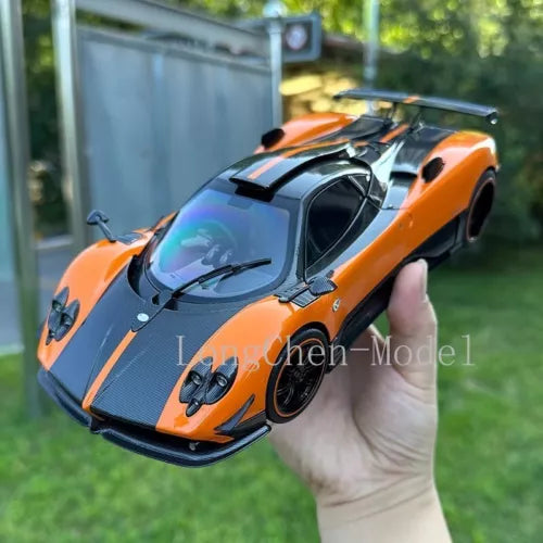 Orange and dark gray 1:18 metal diecast sports car model with rear wing
