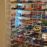 Diecast car display with assorted classic cars in a glass case