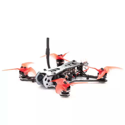 Freestyle racing drone with quadcopter frame, red arms, black motors and antenna