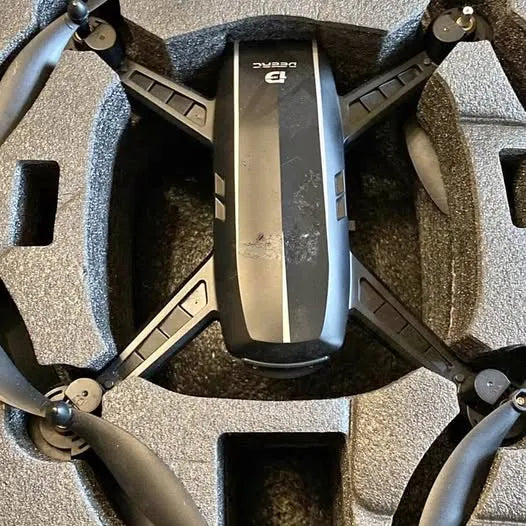 Quadcopter drone top view with four propellers and landing frame