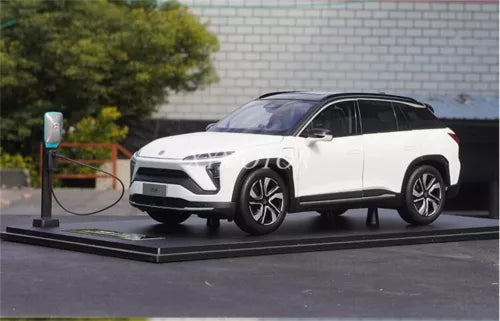 Diecast electric SUV model car, white with blue accents, front three-quarter view