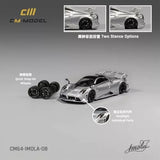 Silver 1:64 diecast model car with black wheels and open-wheel styling.