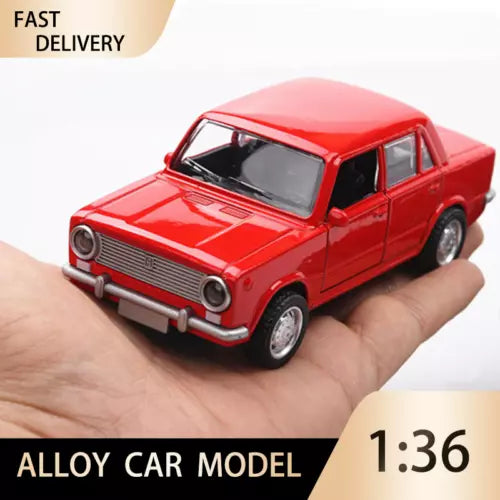1:36 red LADA alloy diecast car model, front view in hand