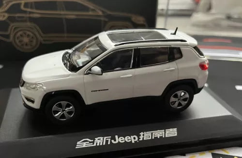 White Jeep Compass diecast alloy model car, side view, on display base