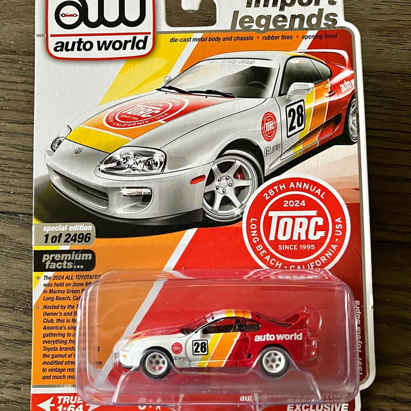 Die-cast sports car model in silver with red racing stripes and #28