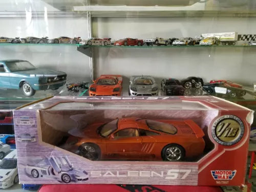 Orange Saleen S7 1/18 diecast model car in retail box, front three-quarter view